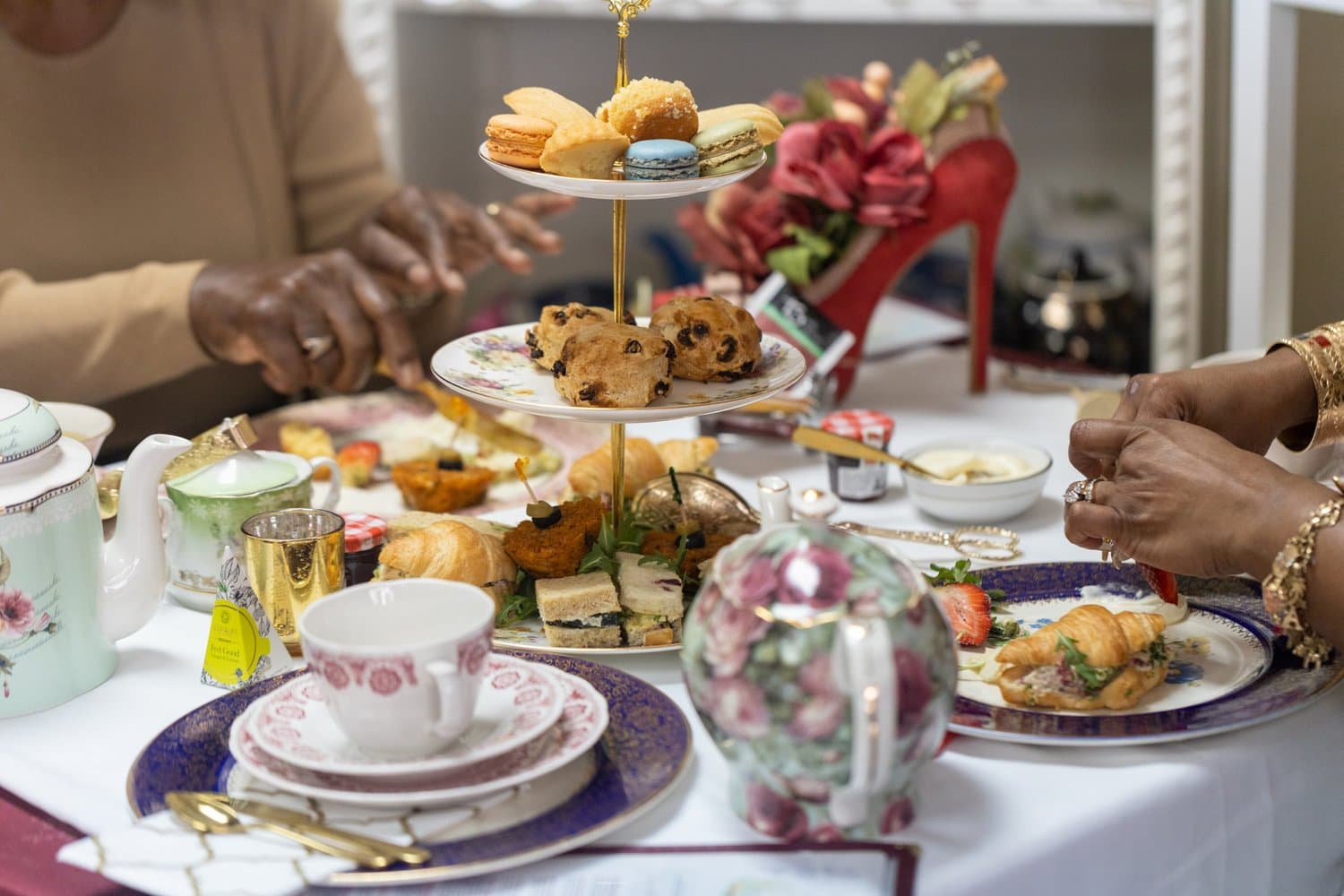 Elegant Edylicious tea service with tiered trays and vintage china